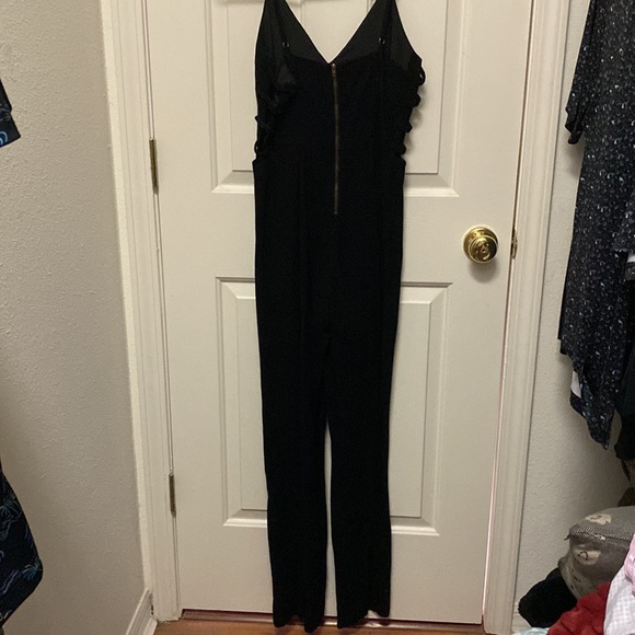 Beautiful black romper! Has cute side detailing in both sides! Only worn 2 times - Picture 3 of 4